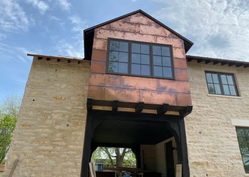 Copper metal panel facade on a stone building for Metal Roof Coating in Taylorville